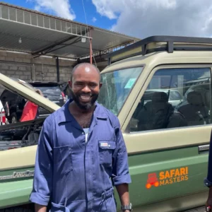 Safari Master Driver Guide in Tanzania Standing next to Self drive 4x4 vehicle