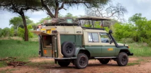 Green jeep with roof rack, designed for self drive uganda experiences, available through Safari Masters.