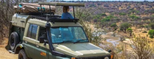 A safari vehicle featuring a roof rack, prepared for excursions in Kenya's landscapes. Is Kenya safe for tourists?