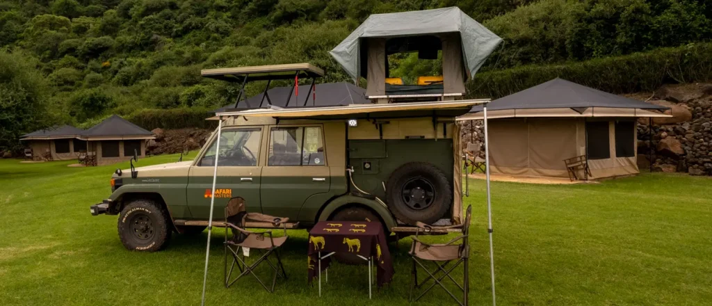 A jeep with a tent on top, symbolizing Uganda responsible travel and outdoor adventure.