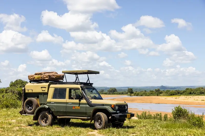 A jeep equipped with a roof rack, ready for safari trips in the Serengeti, highlighting the best time to visit Serengeti.