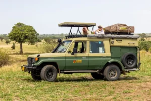 A safari masters vehicle with people on top, exploring the wildlife during a self drive Serengeti adventure.